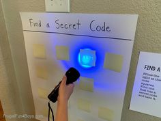 a hand holding a blow dryer in front of a sign that says find a secret code