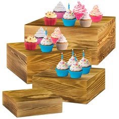 several cupcakes are arranged on wooden boxes