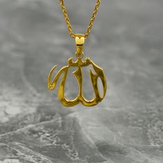 Crafted with exquisite detail and elegance, the Tiny Allah Necklace is a true masterpiece of Islamic jewelry. Made from premium sterling silver and delicately gold plated, this pendant showcases the word "Allah" in beautifully intricate Arabic script. Perfect for Muslim women, this necklace is a meaningful and thoughtful gift that symbolizes faith and devotion. Its tiny size adds a subtle touch of sophistication, making it suitable for everyday wear or special occasions. Whether worn alone or la Classic Gold Charm Necklaces With Polished Finish, Gold Charm Necklace For Wedding, Tarnish Resistant, Gold Tarnish Resistant Charm Necklace For Wedding, Gold Tarnish-resistant Charm Necklace For Wedding, Traditional Gold Nameplate Necklace, Gold Spiritual Initial Pendant Jewelry, Spiritual Gold Jewelry With Initial Pendant, Spiritual Gold Initial Pendant Jewelry, Traditional Gold Personalized Necklaces