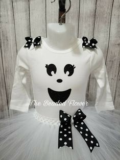 "Halloween Orders Last day to order for guarantee delivery for halloween will be Oct. 22. Thank you. This adorable ghost costume will look adorable on any little one. Please select the size needed when ordering. Top will be a long sleeve bodysuit/shirt with a glitter ghost face vinyl image on the front. The tutu skirt will be all white, white/black, or all black made on a crochet band with two layers of tulle and a removable bow on an alligator clip. Shoulder bows will be added, if you do not wa Cute Halloween Tulle Tutu Dress, Cute Halloween Costume Tutu Dress, Cute Tutu Dress For Halloween Costume, Fitted White Tutu Dress For Costume Party, White Long Sleeve Tutu Dress For Party, Fitted Tutu Dress For Birthday Halloween, White Fitted Tutu Dress For Costume, Baby Costumes Girl, Ghost Costume