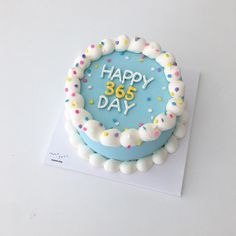 a birthday cake with the words happy 80's day written in frosting and sprinkles