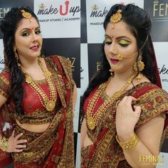 a woman in a red and gold sari with her hands on her hips, posing for the camera