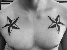 a black and white photo of a man's chest with three stars on it