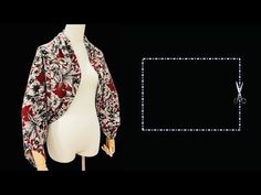 a mannequin wearing a floral jacket with scissors on it