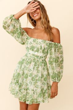 Green floral print dress  Off-shoulder style  Balloon sleeves  Gathered detailing in bust  Waist band  Tie-up back  Zipper in back   You'll be stealing hearts in our adorable Abby dress. We are obsessed with the off-shoulder style and super cute, tie-up back! Perfect for a girls' day out, getting matching manis and shopping 'til you drop. Team it with a cute head scarf, mules and a tote. Cute Head Scarf, Women Cottagecore, Green Floral Print Dress, Charlotte Dress, Balloon Sleeve Dress, Cottagecore Dress, Off Shoulder Fashion, Green Floral Print, Mini Dresses Summer