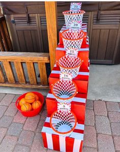 several basketballs are stacked on top of each other in front of a basket ball stand