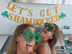 two women with st patrick's day decorations on their faces