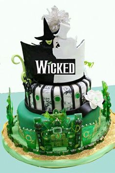 the cake is decorated with green and white icing, which reads'woked '