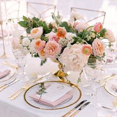 an elegant table setting with pink and white flowers