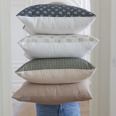 four pillows stacked on top of each other