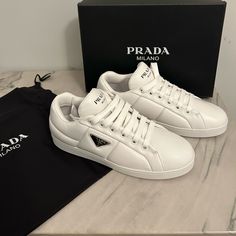 Questions? Comment Below! Luxury White Sneakers With Logo Plaque, Designer White Calf Leather Sneakers, Elegant White Calf Leather Sneakers, White Formal Sneakers With Round Toe, Elegant White Leather Sneakers, Prada Sneakers Women, Prada Cloudbust Thunder Sneakers, Prada Cloudbust, Prada Sneakers