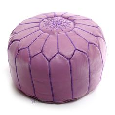 a purple leather poufle with an intricate design on the front and back side