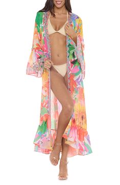 A vibrant tropical-inspired pattern enlivens this vacation-ready duster framed with three-quarter ruffle sleeves. 52" length (size One Size) Open front Three-quarter sleeves 100% polyester Hand wash, dry flat Imported Swimwear Cover Ups, Three Quarter Sleeves, Front Open, Three Quarter, Cover Up, Floral Prints, Nordstrom, Clothes For Women, Floral