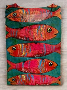 a colorful bag with fish painted on it