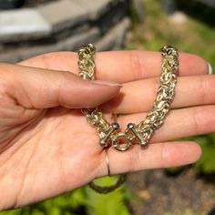 14KT yellow gold Byzantine weave necklace with cabochon sapphires end caps detailing, easy-to-use toggle ring clasp. Two styles in one necklace- wear the toggle in front or in the back! You can even hang a pendant off the toggle for added interest! Length: 18" Made in Italy Weight: 24.80 grams Toggle spring ring clasp measures: 11mm Endcaps: 15mm Chunky links measures: 9.5mm wide 14K toggle clasp (4) cabochon blue sapphires Classic Yellow Gold-plated Toggle Necklace, Gold-tone Gold Plated Toggle Necklace, Gold-tone Link Toggle Necklace With Adjustable Chain, Classic Gold-tone Jewelry With Toggle Clasp, Vintage Gold-tone Jewelry With Toggle Clasp, Pearl Accessories, Woven Necklace, White Gold Bracelet, Rose Gold Pendant