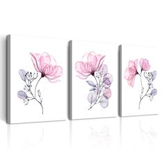 three pink and purple flowers on white canvases, each with one flower in the middle