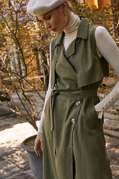 This stylish belted trench has been accented with large tortoise buttons, a matching fabric belt, and an elegant lapel-collar. Designed in a sleeveless midi silhouette it's easy to style with a camisole, blouse, or fitted turtleneck. Content: 100% Linen Hand wash warm Button-down style Belted Unlined Length: S = 119 cm (46.5") M = 122 cm (47.5") L = 125 cm (49") XL = 128 cm (50") 2XL = 130 cm (50.5") 3XL = 132 cm (51.5") Sleeveless Trench, Trench Dress, Fitted Turtleneck, Belted Trench Coat, Neutral Fashion, Fabric Belt, Womens Clothing Sizes, Ethical Fashion, Lapel Collar