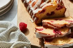 a loaf of lemon raspberry pound cake on a cutting board