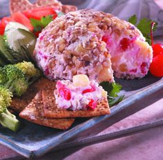 a blue plate topped with fruit and veggies