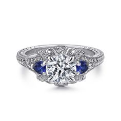 a diamond and blue sapphire engagement ring with an intricate design on the shan shan shan shan shan shan shan shan shan shan shan shan shan shan shan shan shan shan shan shan shan shan shan shan shan shan shan shan shan shan shan