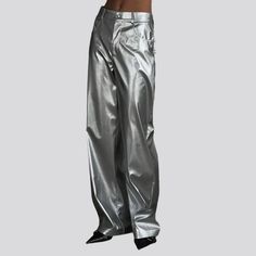 Introducing the 2023 Spring-Summer Collection's street-style silver elevated-rise jean pants—a trendy must-have for stylish trendsetters who love to make a bold statement! These wide leg denim pants feature a flattering high-waistline silhouette. with a zipper and button closure that lets you adjust the fit type for maximum comfort.Why You'll Love These PantsNail the street-style vibe and showcase your fashion-forward style with these silver tall-waist jeans that combine vintage charm and coutur Chic High-waist Pants For Streetwear, Baggy Full Length Jeans For Summer, Shiny Solid Color Bottoms For Party, Solid Shiny Bottoms For Party, Shiny Solid Color Party Bottoms, Trendy Solid Wide Leg Full Length Pants, Solid Shiny Party Bottoms, Sleek Shiny Pants For Fall, Sleek Shiny Fall Pants