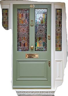 a green front door with stained glass panels