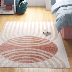 a bedroom scene with focus on the rug