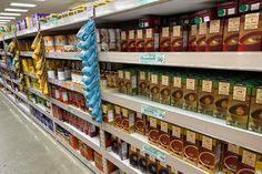 shelves in a grocery store filled with lots of food