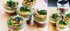 four jars filled with food sitting on top of a wooden table next to each other