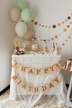 a birthday party with balloons, cake and confetti