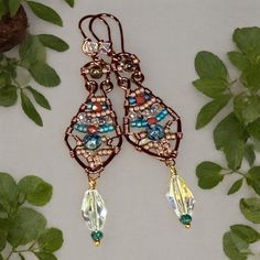 These Boho Earrings are handmade for royalty. These are fit for the Queen you are! Walk with confidence, stand tall, sparkle and dazzle them all! Various pink toned beads and turquoise beads are wrapped to perfection in these beauties!  Swarovski faceted beads dangle below! Lots of color! Boho inspired!! Adjustable Bohemian Beaded Wrap Earrings, Handmade Copper Earrings For Party, Bohemian Beaded Dangle Wrap Earrings, Festival Wire Wrapped Beaded Drop Earrings, Wire Wrapped Beaded Drop Earrings For Festival, Handmade Copper Crystal Drop Earrings, Handmade Copper Drop Crystal Earrings, Turquoise Beaded Copper Earrings, Handmade Bohemian Crystal Earrings