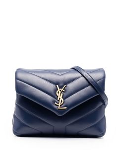 Saint Laurent crossbody bag in signature Y-quilted leather. Removable shoulder strap. Envelope flap with YSL logo; snap closure. Center slip pocket divides interior. One zip and one slip pocket. 5.1"H x 7.9"W x 2.8"D. Made in Italy. Ysl Toy Loulou, Ysl Toy, Bag Names, Logo Azul, Toy Bags, Designer Crossbody Bags, Saint Laurent Bag, Purses Designer, Cute Bags