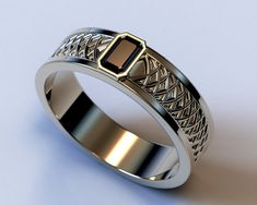 a wedding band with a black stone in the center