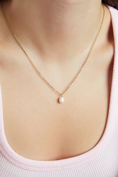 TINY FRESH WATHER PEARL NECKLACE GOLD MOTHER OF PEARL NECKLACE *Water Resistant   *WATERPROOF *You can wear gym, pool, shower or everywhere *Tarnish Free *Hypoallergenic *The necklace is hand crafted METARIAL  Dainty Chain : Gold Plated stainless steel Pearl Material : Fresh Water Pearl - 7 mm  HOOP SIZE 12 mm NECKLACE LENGTH  18 INCHES ( IF YOU WANT A DIFFERENT LENGTH LET ME KNOW Enjoy the convenience of free Shipping over 35$ Dainty Charm Necklace With Pearl Chain For Gift, Delicate Pearl Charm Necklace For Mother's Day, Gold Necklaces With Pearl Charm For Bridesmaids, Gold Necklace With Pearl Charm For Bridesmaids, Dainty Pearl Pendant Drop Necklace For Gift, Dainty Pearl Pendant Necklace For Mother's Day, Dainty Gold Pearl Necklace For Bridesmaid, Gold Necklace With Pearl Pendant For Bridesmaid, Dainty Pearl Drop Charm Necklace Gift