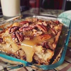 a dessert dish with pecans and caramel drizzled on the top