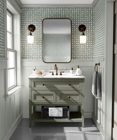 a bathroom with two sinks and a large mirror