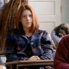 two women sitting next to each other in chairs