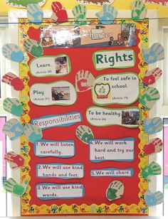 a bulletin board with handprints on it and words written in different languages that spell out rights