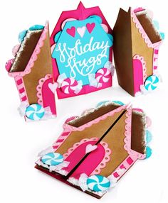 some kind of box that is made to look like a gingerbread house with the words holiday hugs on it