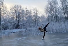 a person skating on an ice covered pond