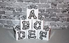 a stack of blocks with letters and skulls on them