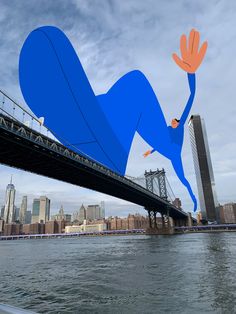 an image of a man floating in the air on top of a bridge over water