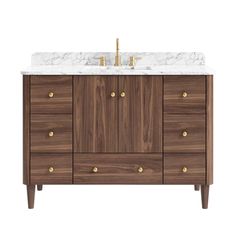 an image of a bathroom vanity with marble top and gold handles on the sink area