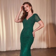 Elevate Your Evening Look With Our Exquisite Long Gown Featuring A Stunning Beaded Tulle Overlay That Exudes Opulence And Elegance. The Captivating V-Neckline Adds A Touch Of Allure And Sophistication, Framing Your Neckline With A Hint Of Drama. Fabric: Beaded Tulle Overlay Length: Long Color: Emerald Neckline: V-Neck Silhouette: Mermaid Sleeve: Short Sleeves Back: Zipper Features: Pearls Occasion: Romantic Date/Evening/Dinner, Wedding/Bridesmaid, Graduation, Fashion Show, Visiting Theater/Museu Mermaid Tulle Dress, Graduation Fashion, Long Mermaid Dress, Evening Dinner, Exquisite Gowns, Evening Dresses With Sleeves, Beaded Tulle, Cinderella Dresses, High Fashion Outfits