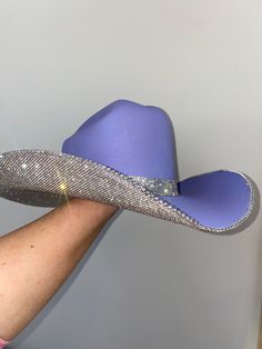 Inspired by Taylor Swift's Eras Tour, we custom made a purple hat with crystal rhinestones and a matching hat band. Sizing: This hat is a a one size fits all! The band on the inside is a stretchy band; all orders come with a custom Rhinestone Cowgirl dust bag and foam pieces that can be stuck behind the hat band to reduce the size. Western Style Hat With Bling And Curved Brim, Rhinestone Fitted Hat For Kentucky Derby, Fitted Rhinestone Hat For Kentucky Derby, Fitted Hats With Rhinestones For Country Events, Fitted Rhinestone Hats For Festivals, Brimmed Hats With Rhinestones For Country Events, Festival Fedora Hats With Rhinestones, Custom Fitted Party Hats, Adjustable Rhinestone Hat Bands For Western-themed Events