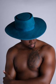 FREE UK POSTAGE  Russo- A beautiful fedora that is lovingly 👋🏽 made from teal woolfelt.  It is trimmed with teal grosgrain ribbon which makes unique detail. It is soft to the touch. The crown is a 5inch porkpie shape with a flat 3.5 inch brim. This hat is a size 23inches and has a custom lined inside. This hat is sure to make you stand out from the crowd.  I can make this hat in any colour combinations of your choice.  I can also make it in furfelt (which is a higher grade felt).  This will co Blue Flat Brim Felt Hat For Kentucky Derby, Blue Fitted Fedora With Flat Brim, Blue Short Brim Felt Hat For Fall, Fitted Blue Brimmed Fedora, Blue Fitted Fedora With Wide Brim, Blue Flat Brim Fedora For Fall, Fitted Blue Western Fedora, Blue Fitted Wide Brim Fedora, Blue Wide Brim Felt Hat For Fall