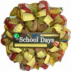 a school day wreath made out of burlocks and measuring tape with the words school days written on it