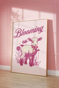 a pink room with a framed poster on the wall that says blooming and a sheep standing in front of it