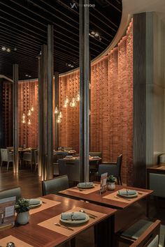 an empty restaurant with wooden tables and chairs