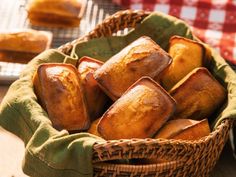 a basket filled with pastries sitting on top of a table